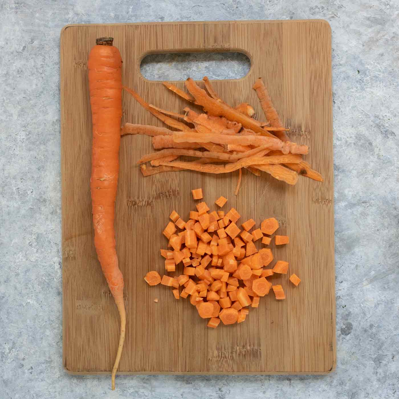 Carrots on a wooden cutting board.