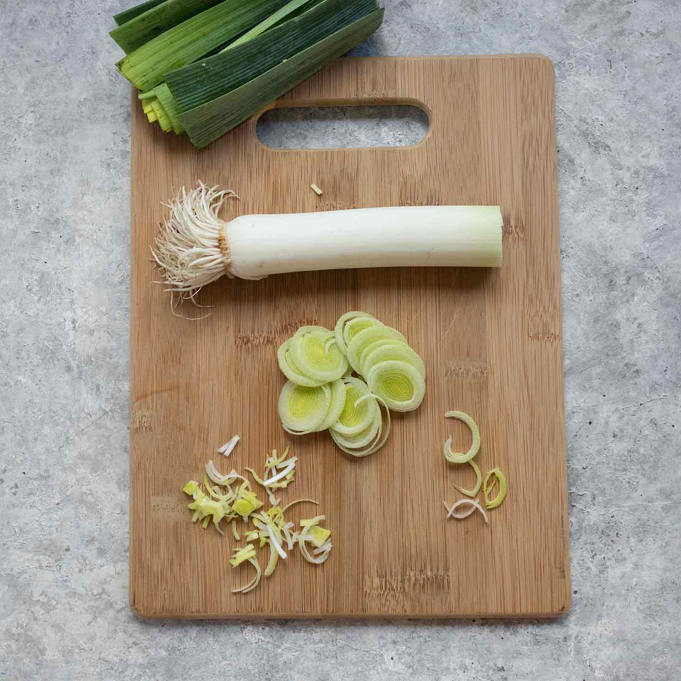 Sliced leeks on a cutting board.