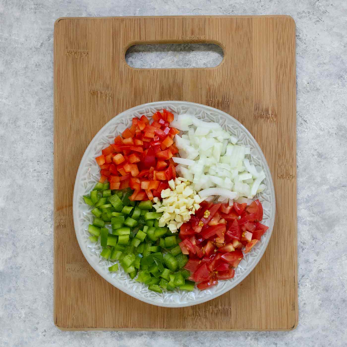 Sofrito vegetables on a plate.