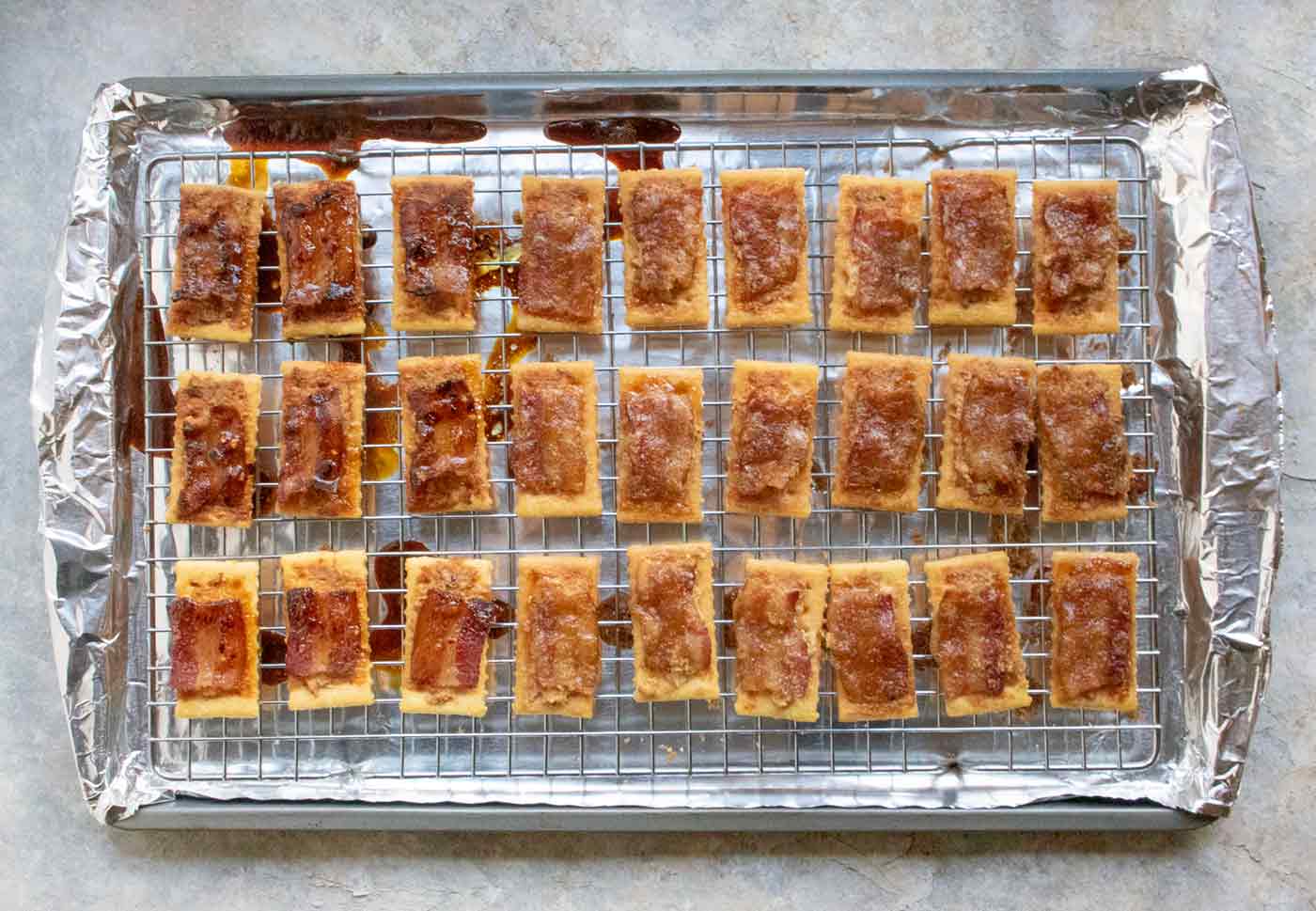 Baked Bacon Crackers cooling on the wire rack.