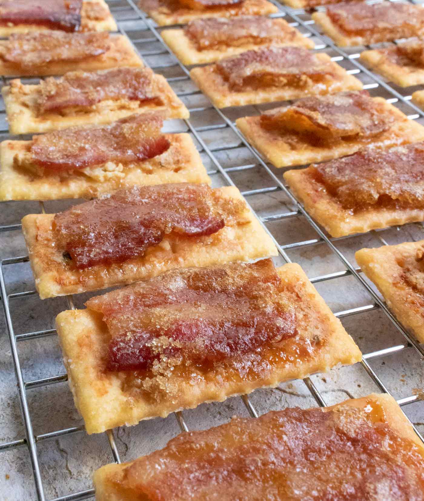 Bacon Crackers with Boursin on a wire rack.