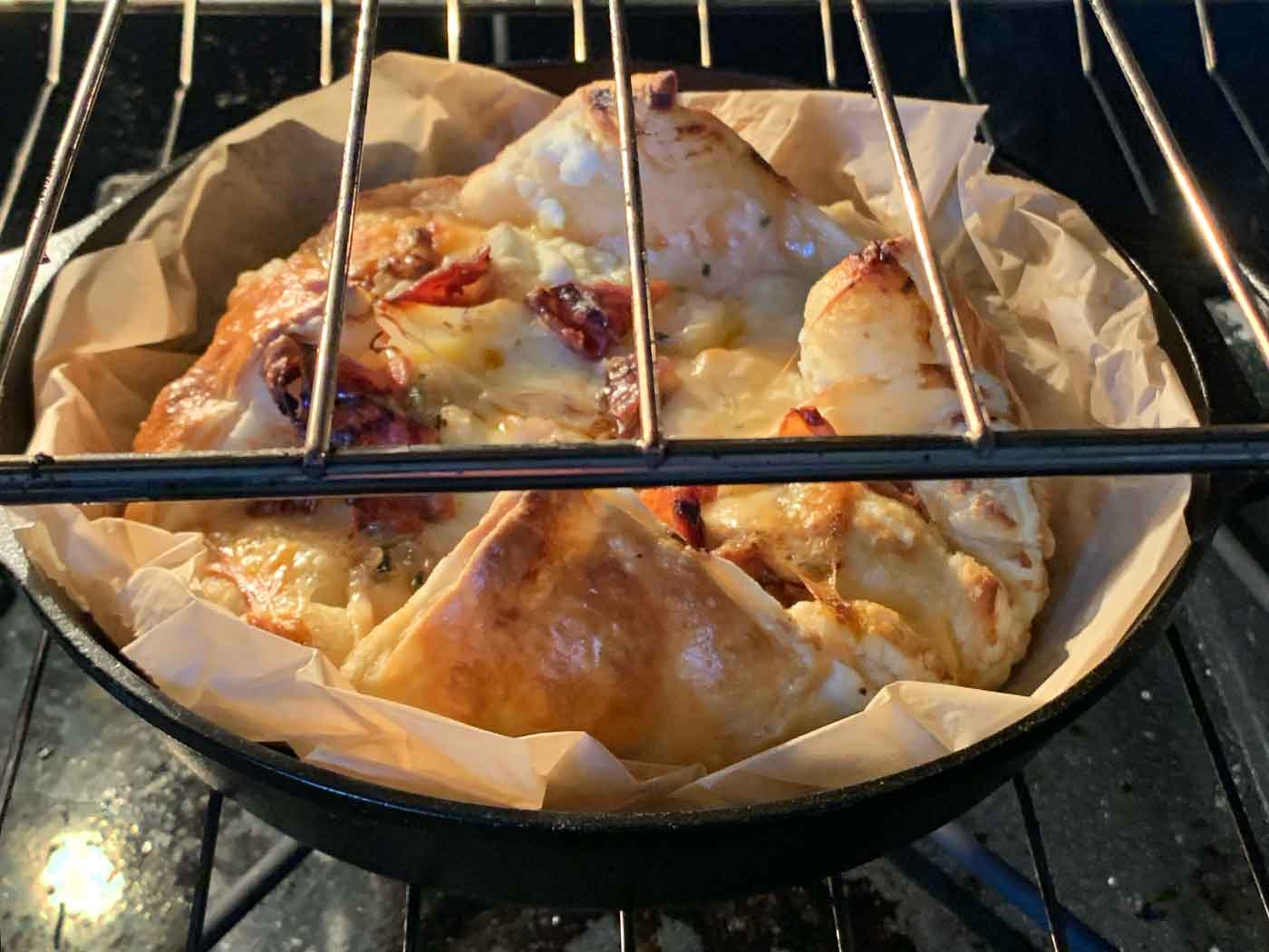 Baked Cheesy Puff Pastry with Crispy Prosciutto baking in the oven.