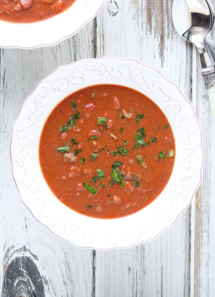 A white bowl with Slow-Simmered Red Bean Soup.