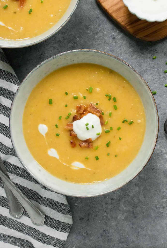 A grey bowl of Instant Pot Potato Leek Soup