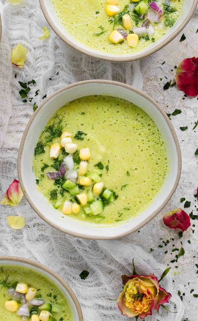 A gray bowl of Smoked Corn Gazpacho.