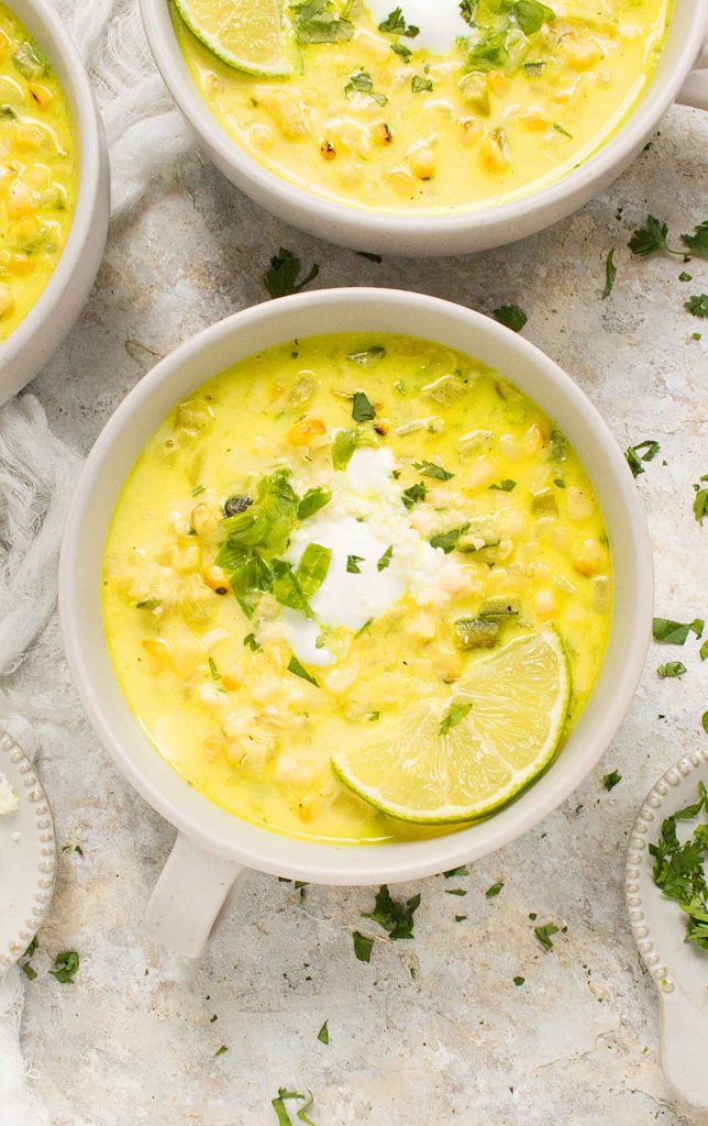 A light grey mug of Mexican Street Corn Soup.
