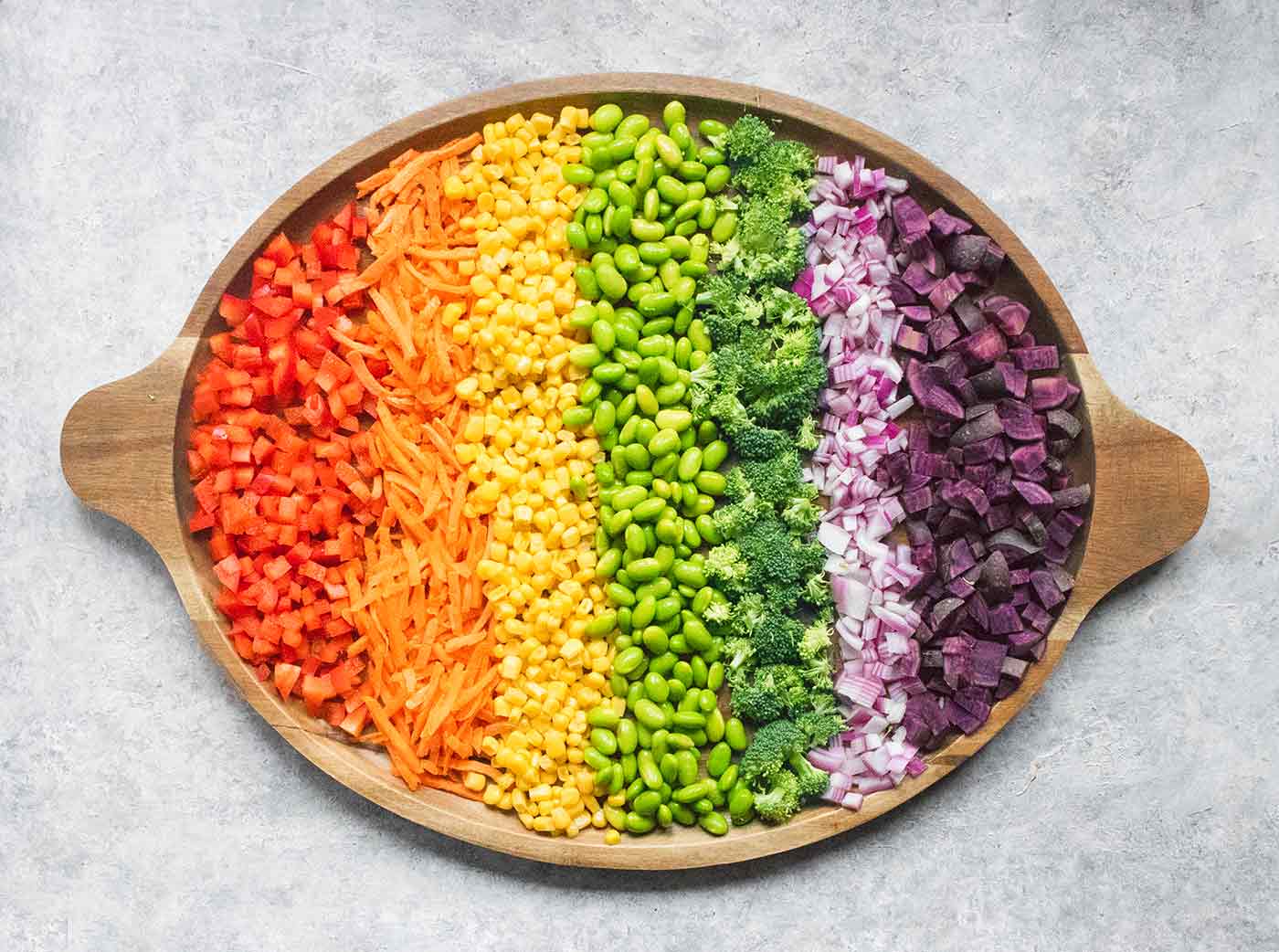 A rainbow of vegetables on a wooden platter