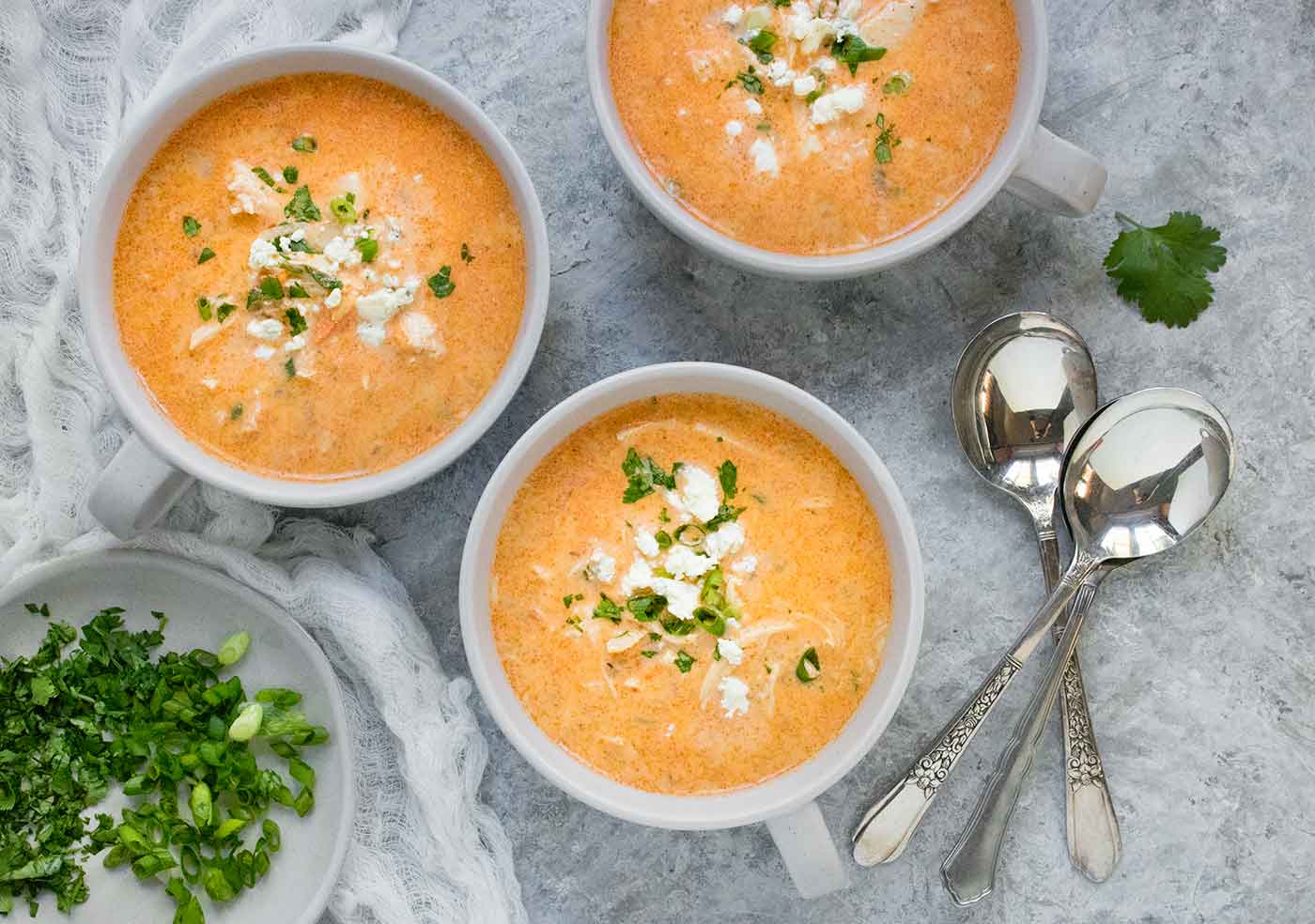 Three soup mugs full of Buffalo Blue Cheese Chicken Soup