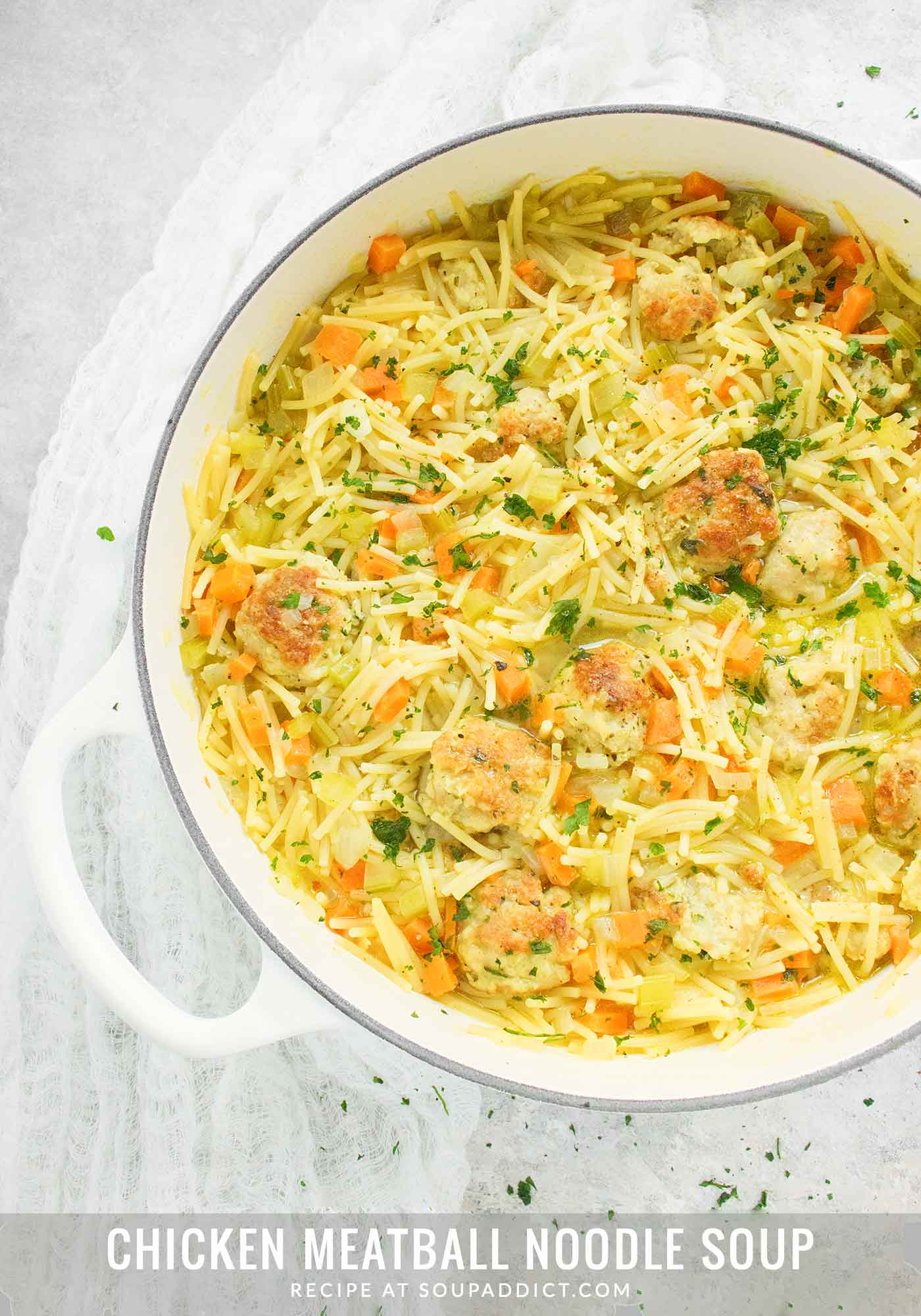 Chicken Meatball Noodle Soup in a big white Dutch oven