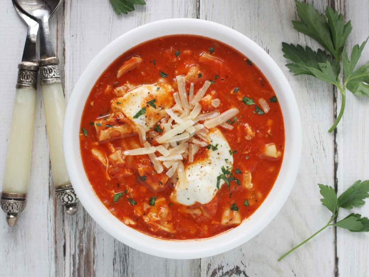 Chicken Parmesan Soup in a white bowl.