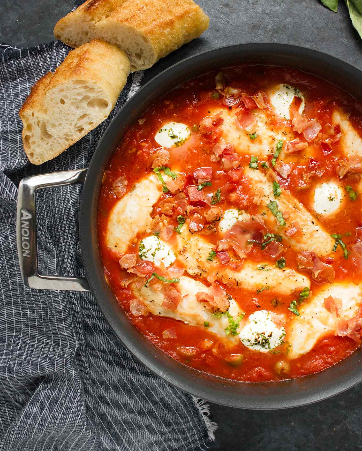Pizza Chicken, ready to serve, with a side of bread