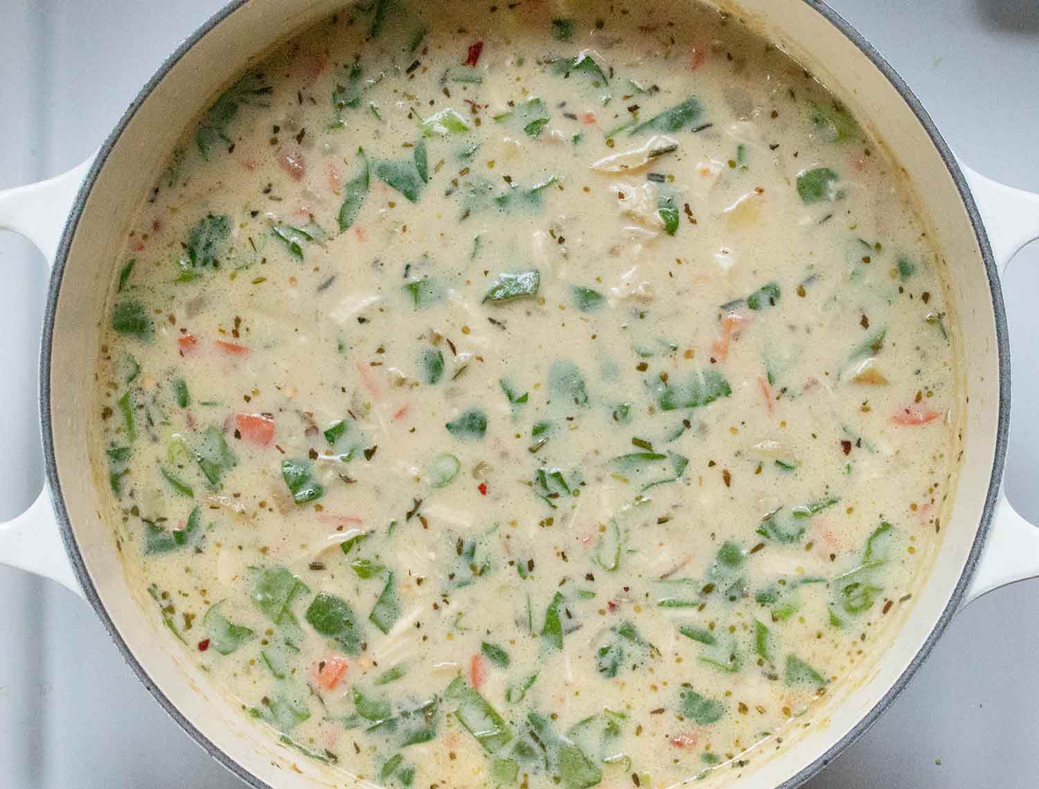 Chicken Potato Soup with Bacon resting on the stove.
