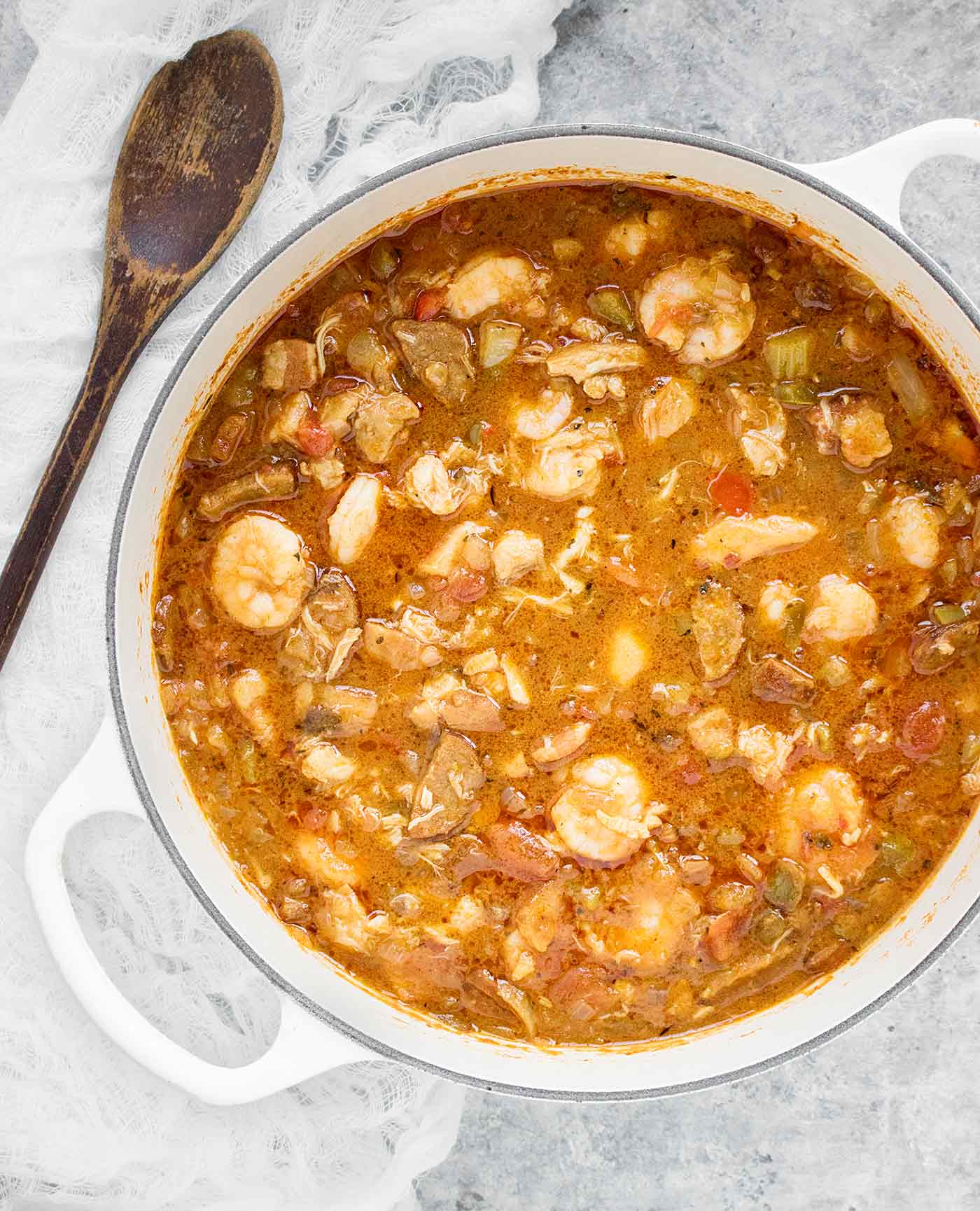 Chicken Seafood Sausage Gumbo in a white Dutch oven, ready to serve