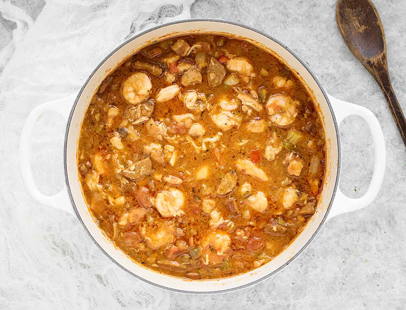 Chicken, Seafood & Sausage Gumbo in a white Dutch Oven