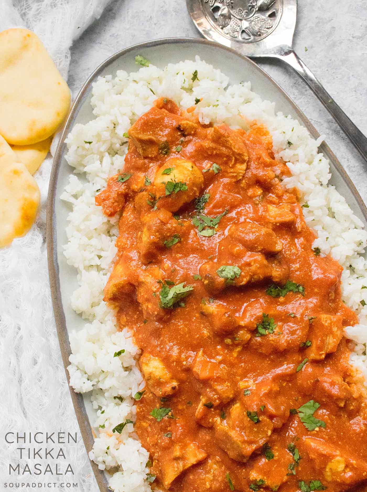 A platter of Chicken Tikka Masala served over rice