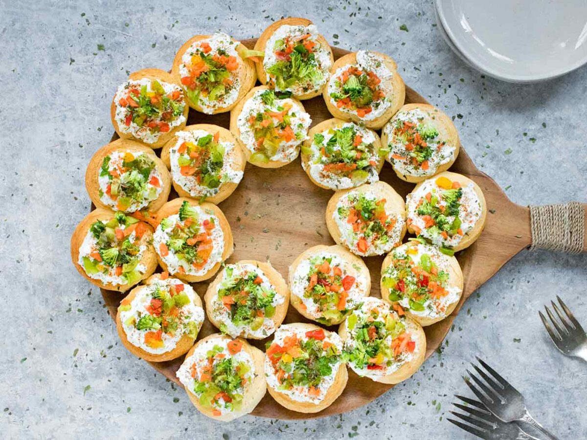 Christmas Wreath Appetizers on a serving board.
