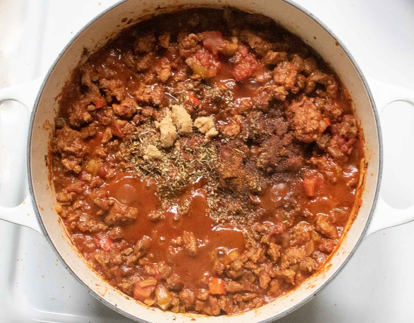 Step 3: Adding more spices to the chili.