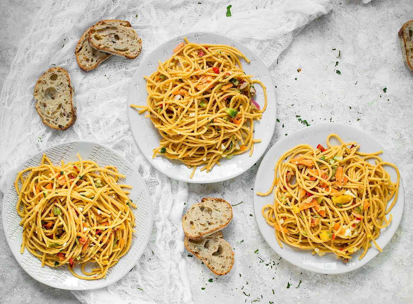 Three plates of Cold Spaghetti Salad
