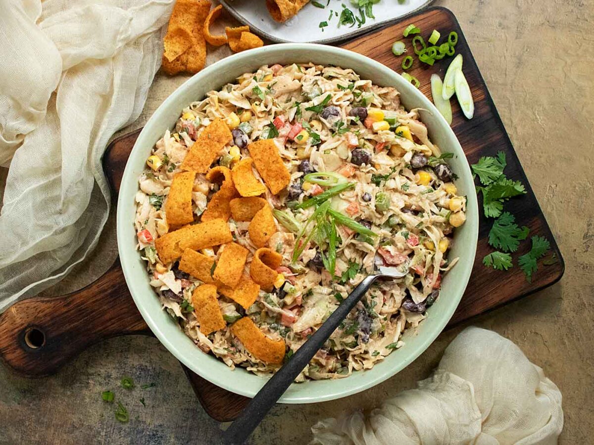 Cowboy Coleslaw with Fritos in a bowl with a fork.