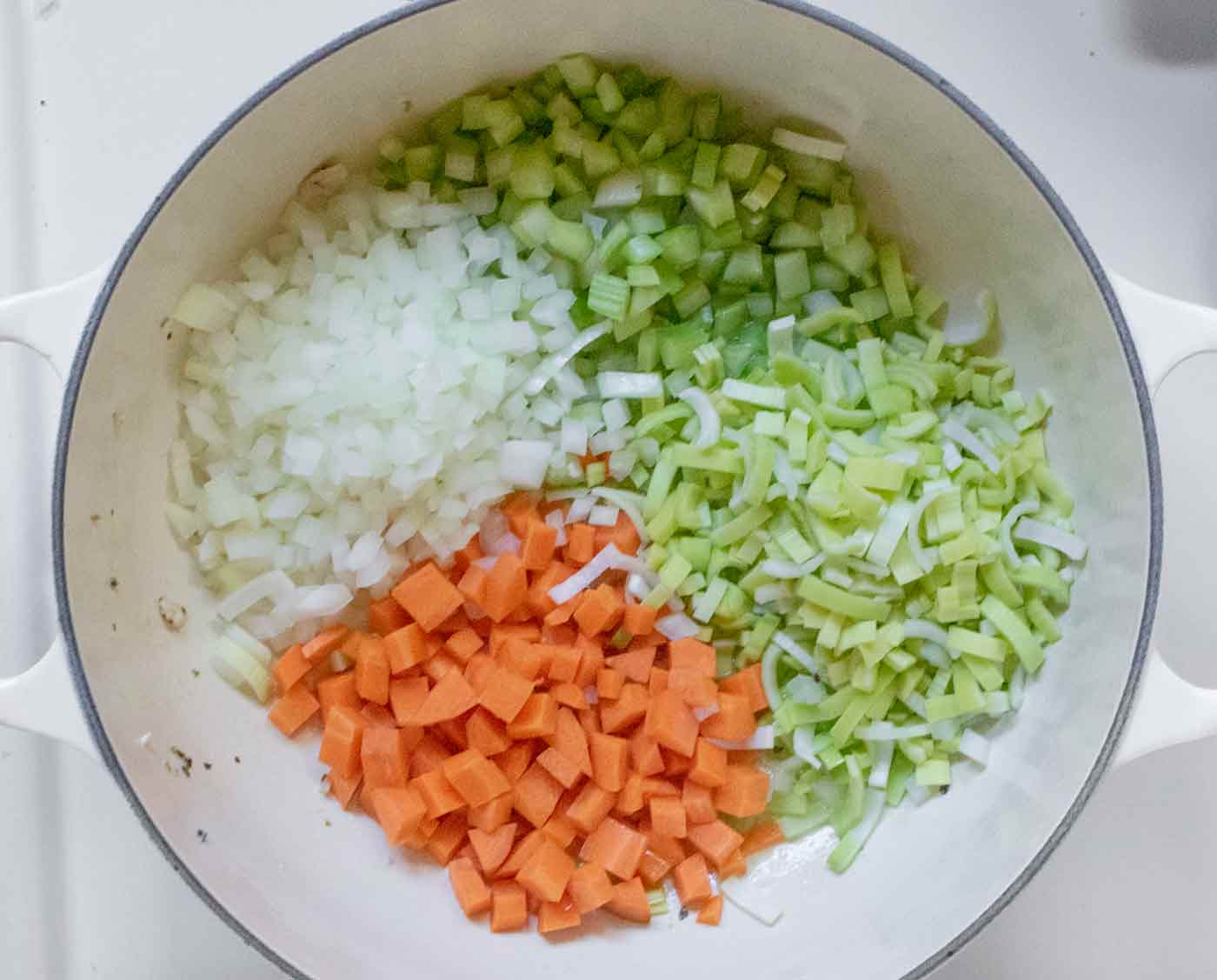 Aromatic vegetables cooking in the pot.