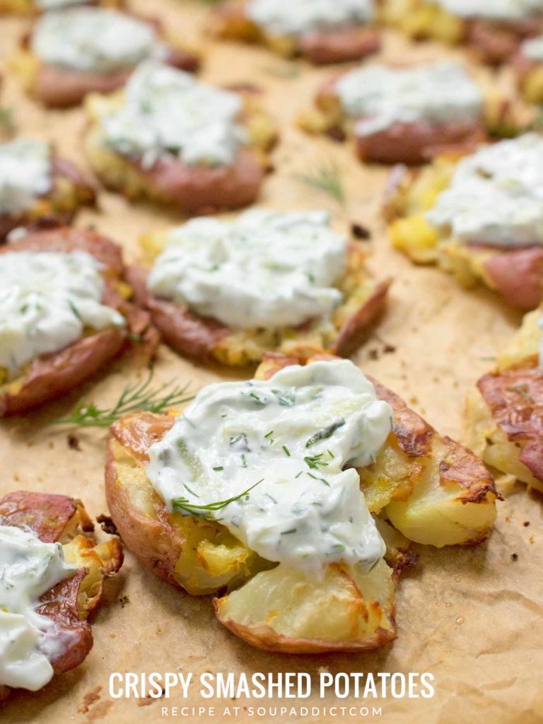 A sheet pan full of crispy smashed potatoes