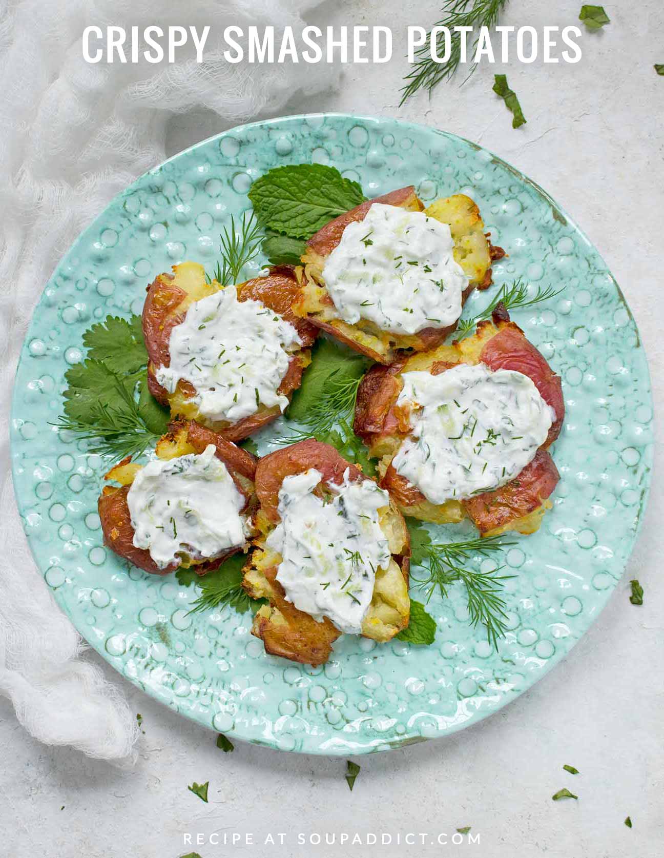 Crispy Smashed Potatoes on a light blue plate.