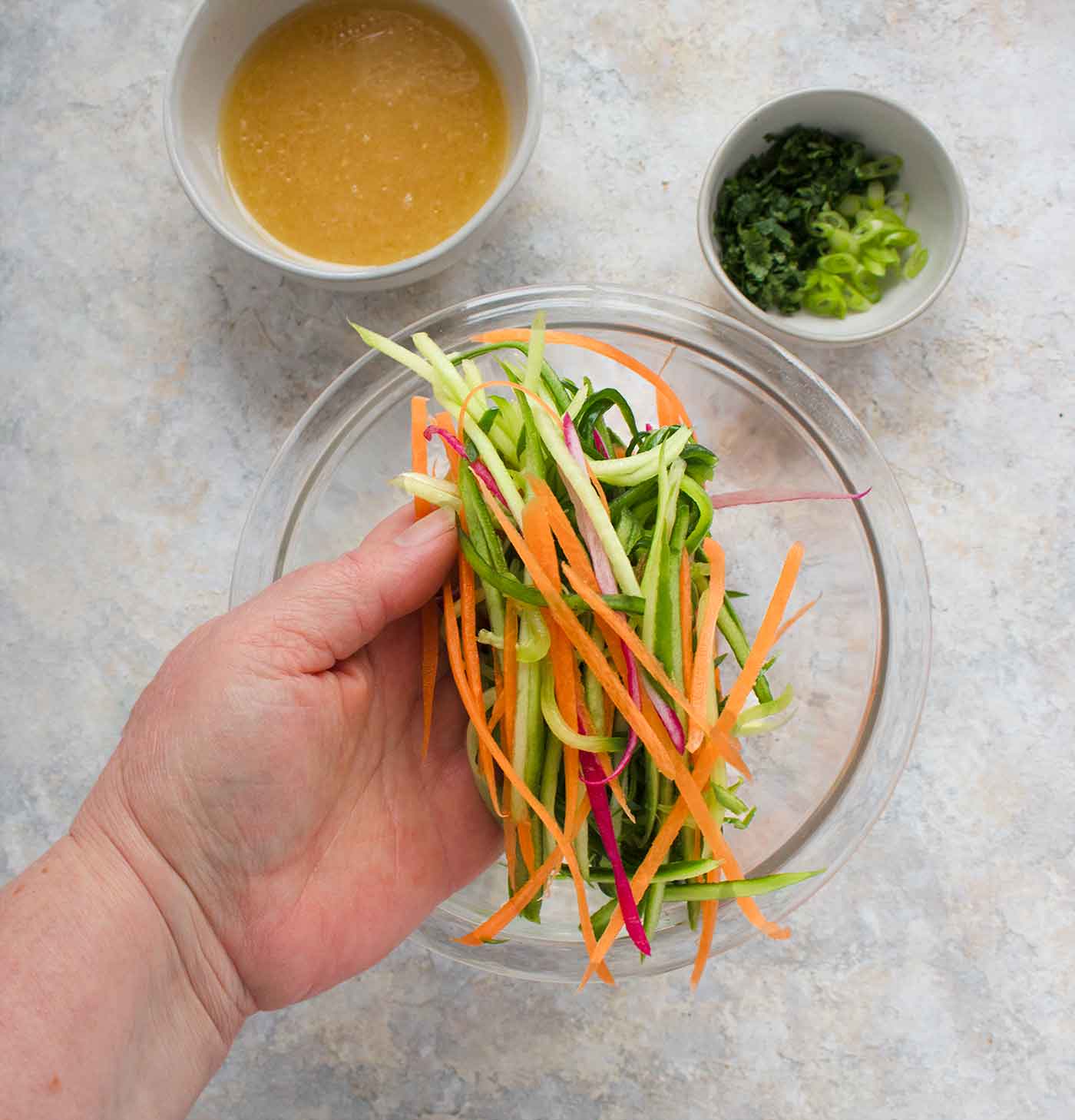 Cucumber slaw vegetables with dressing on the side