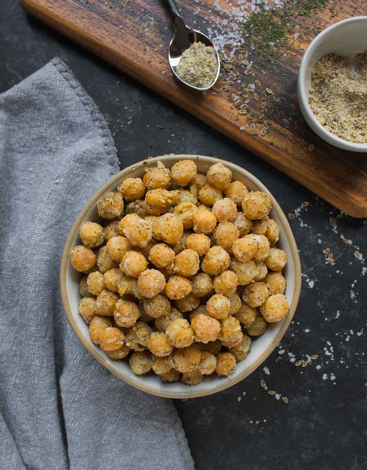 Crispy-fried Dill Pickle Chickpeas in a bowl, with seasonings