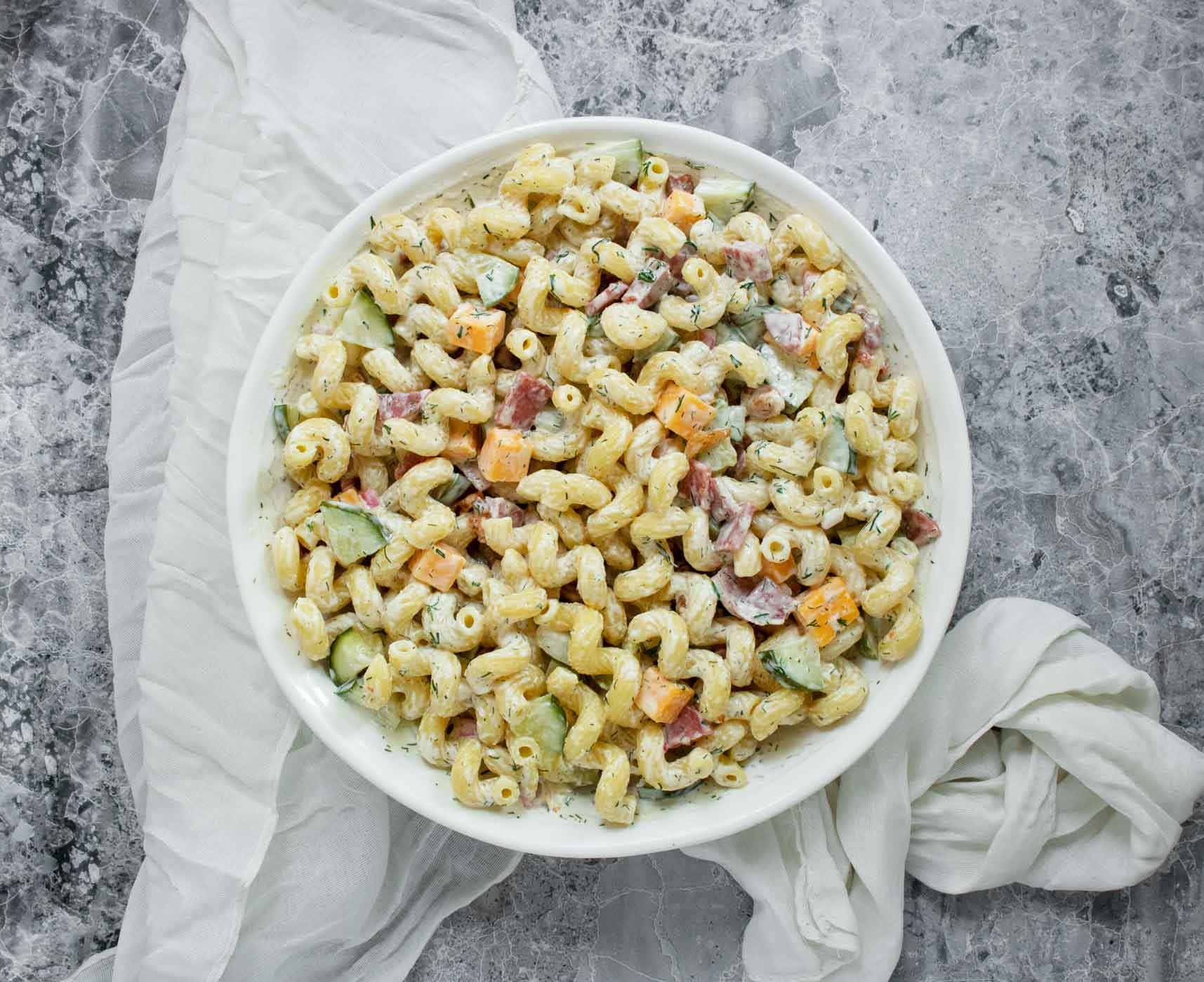 Dill Pickle Pasta Salad in a white serving bowl.