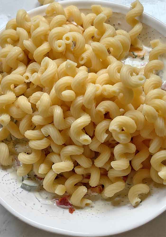 And finally, adding in the cooked and cooled pasta.