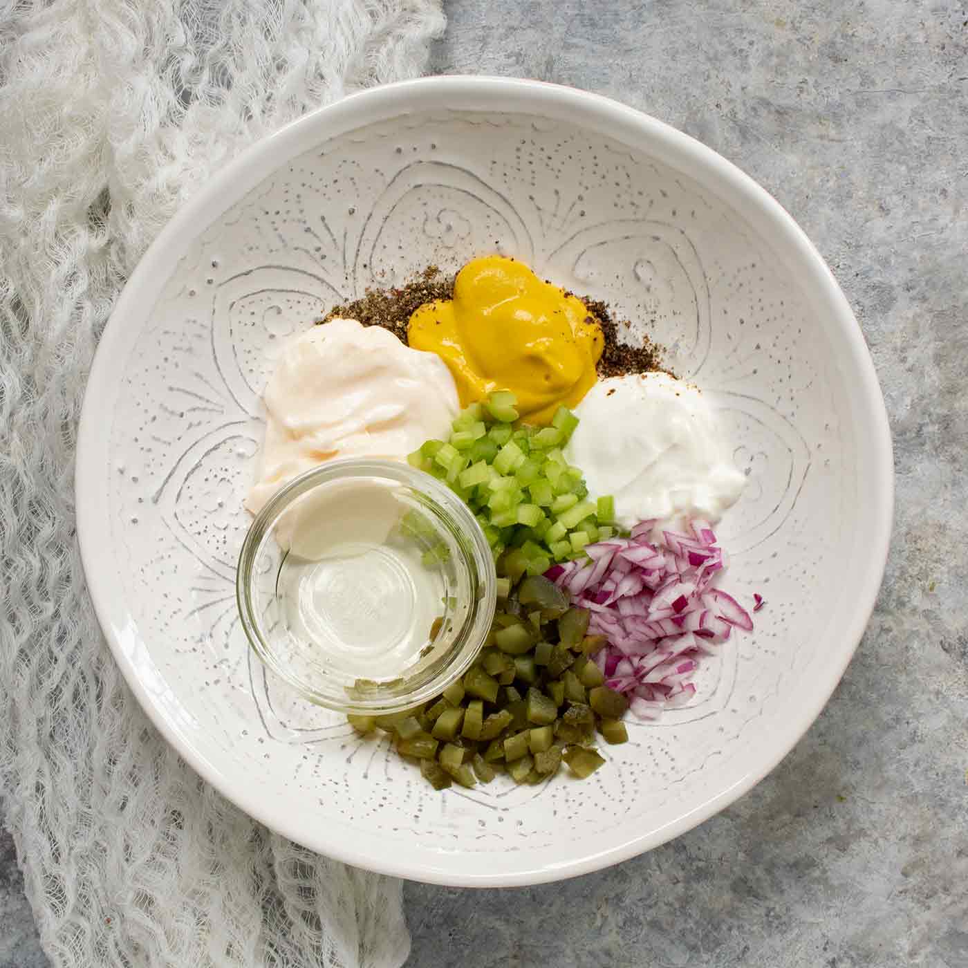 Ingredients in a bowl for Easy Mashed Potato Salad