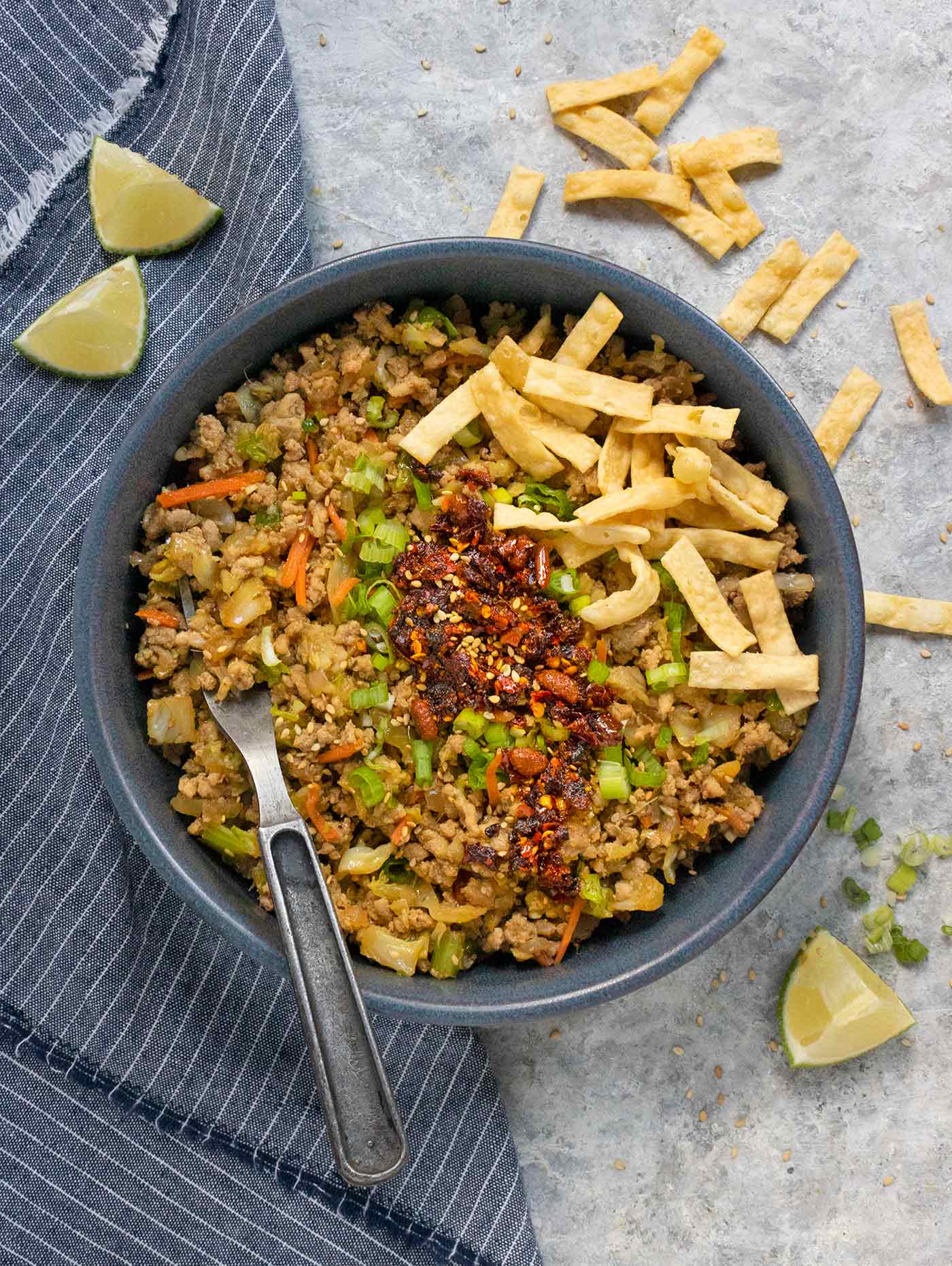 Egg Roll in Bowl in a blue bowl with a fork.