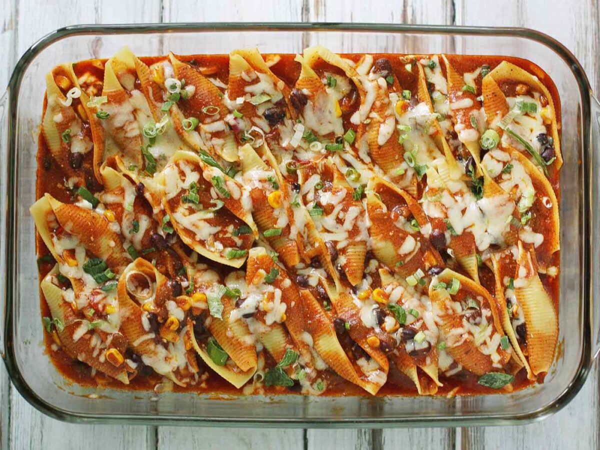 Overhead view of a baking dish filled with Enchilada Stuff Shells.