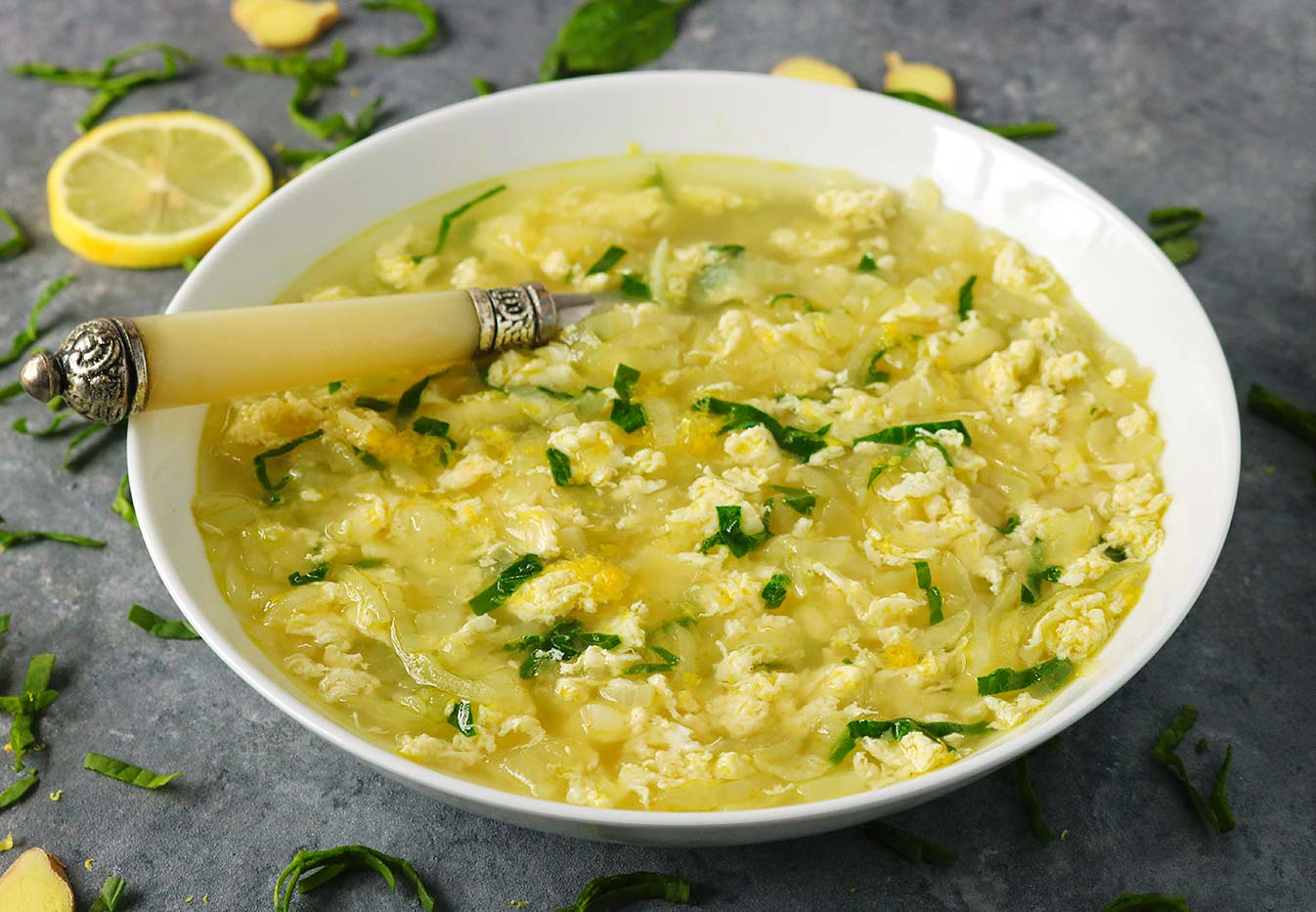 Flu-recovery Shredded Egg Soup in a bowl with a spoon.