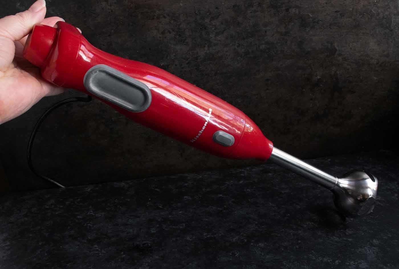 Photo of red immersion blender.