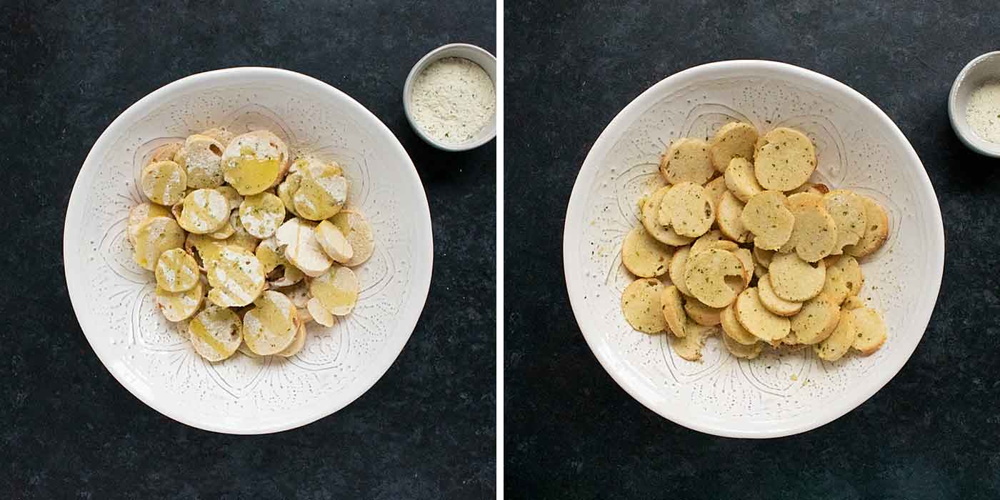 Bagel slices in a large white bowl with olive oil and ranch seasoning.