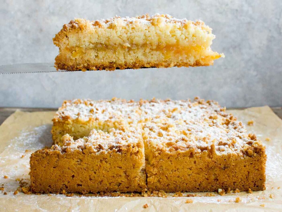 A slice of Hungarian Shortbread bar on a serving knife.