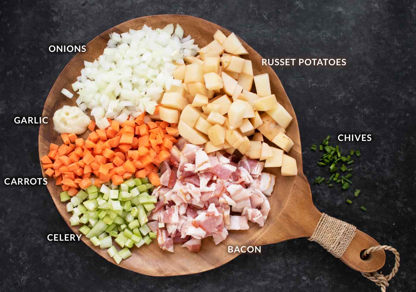 Prepared soup ingredients arranged on a wooden board.