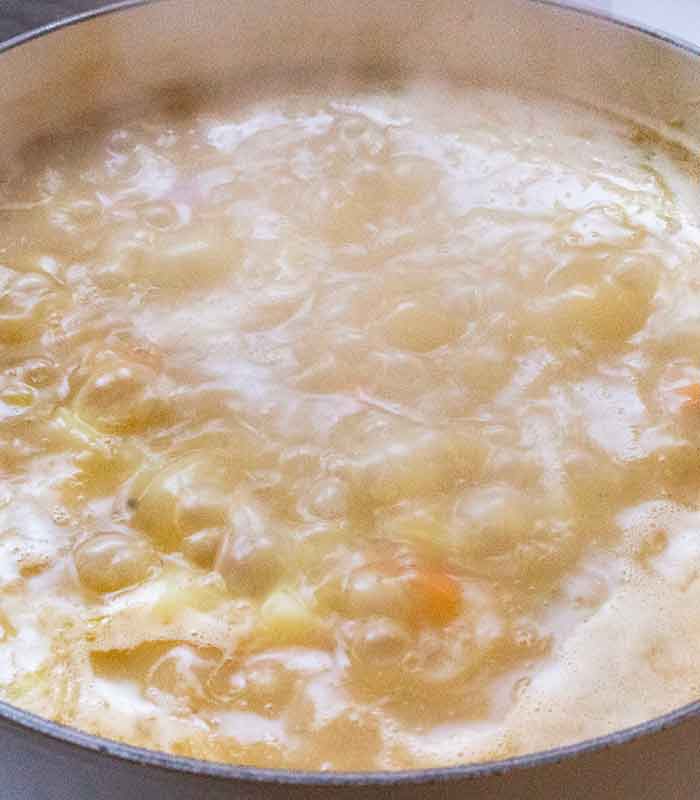 Close-up of surface of the soup in boil mode.