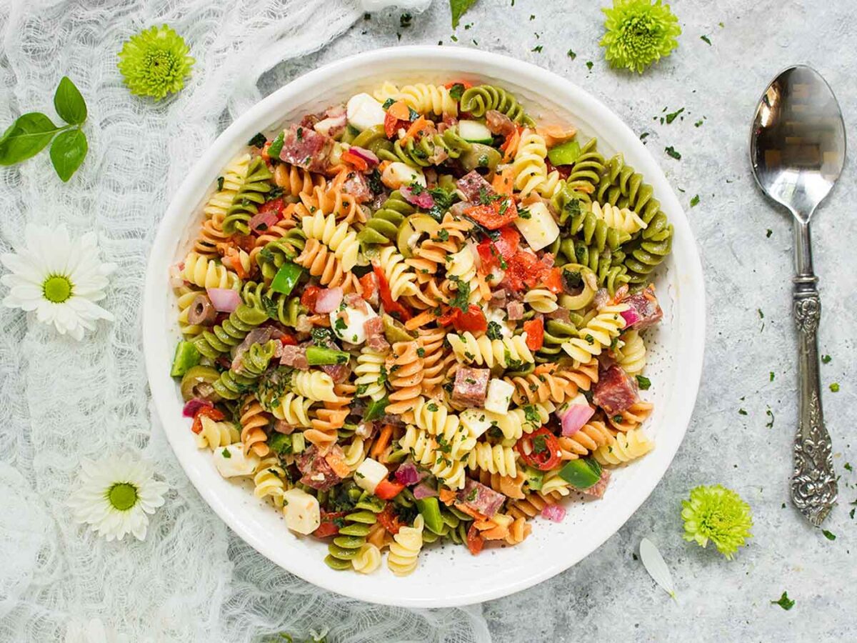 Overhead view of a white serving bowl with Italian Pasta Salad.