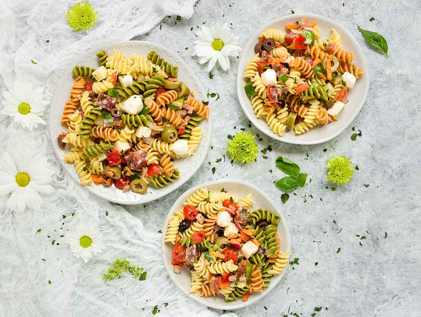 Three plates of pasta salad