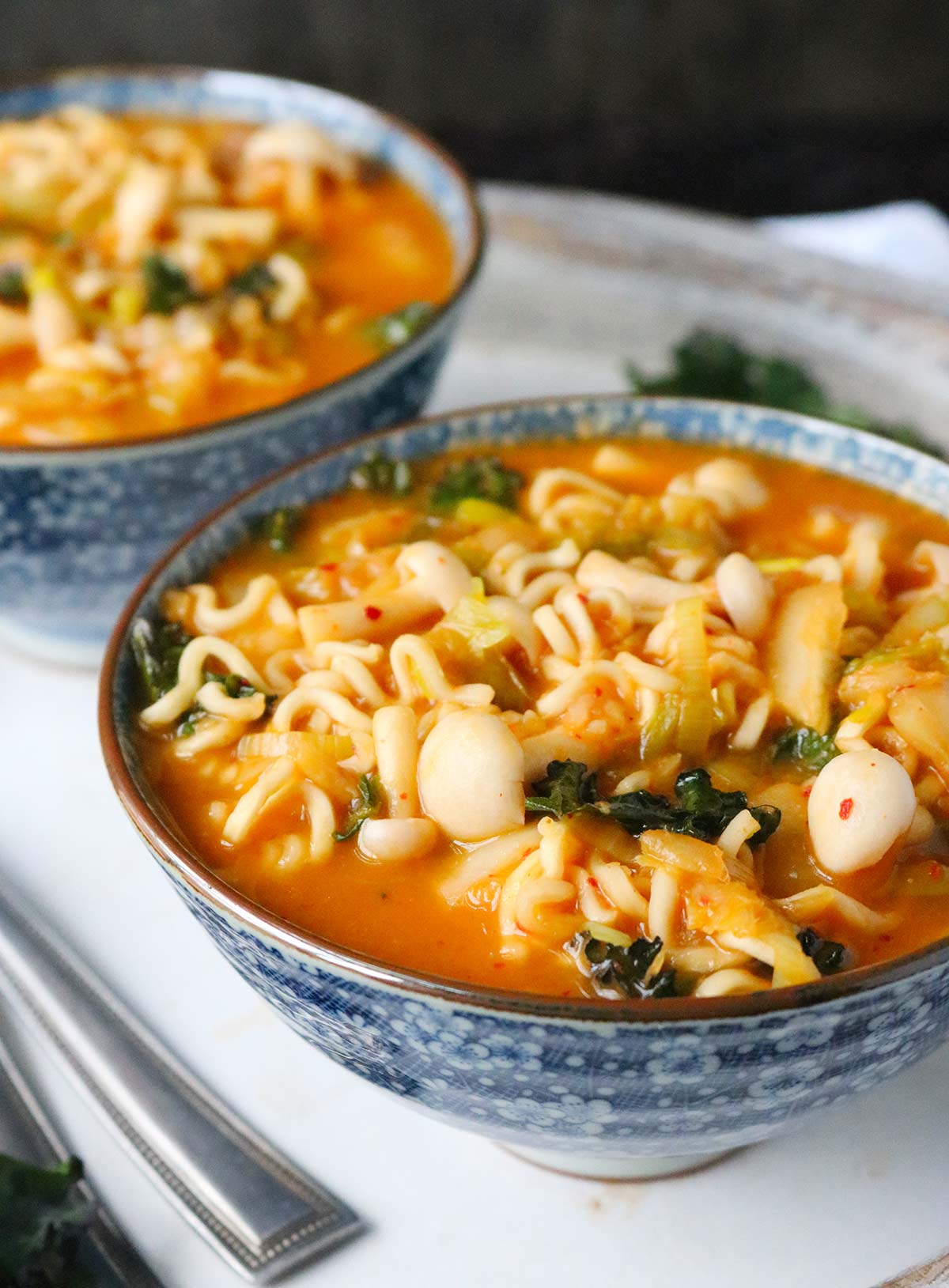 Close up of a bowl of kimchi ramen noodle soup