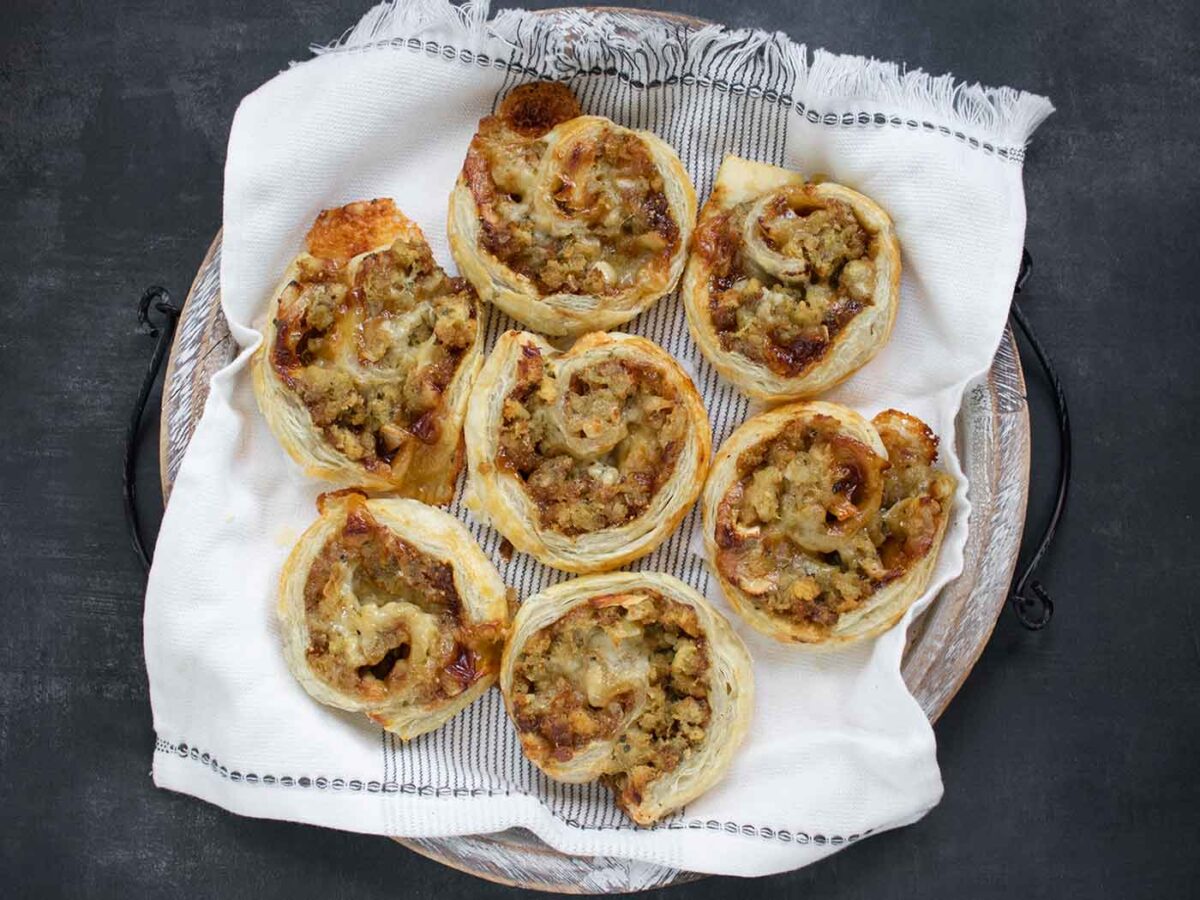 Overhead view of Leftover Stuffing Pinwheels on a serving tray.