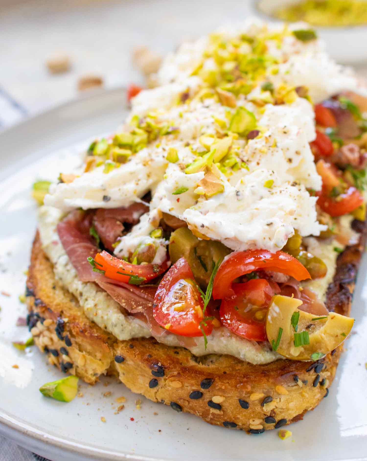 Angled side view of a Mediterranean Burrata Fried Toast.