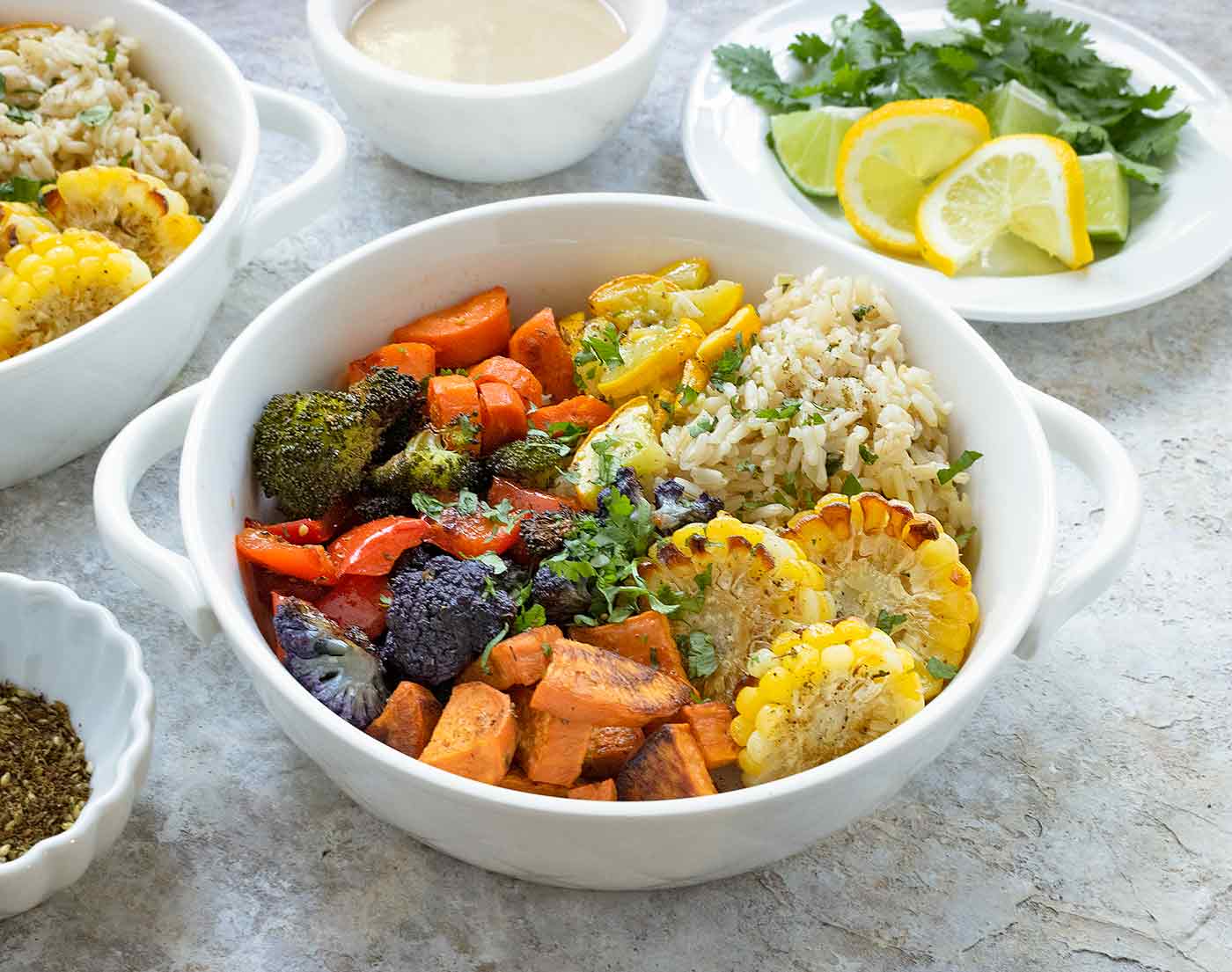 Roasted vegetables in a white serving bowl.