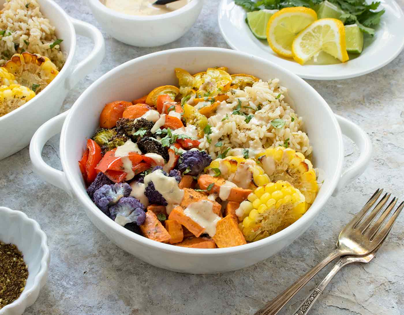 Side view of roasted vegetables in a white bowl.