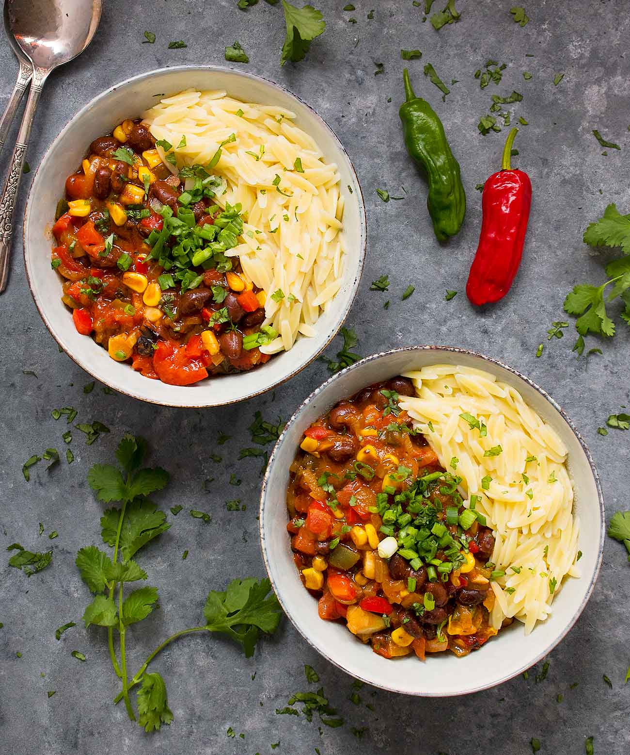 Two bowls of Mexican chili with orzo, ready to serve!