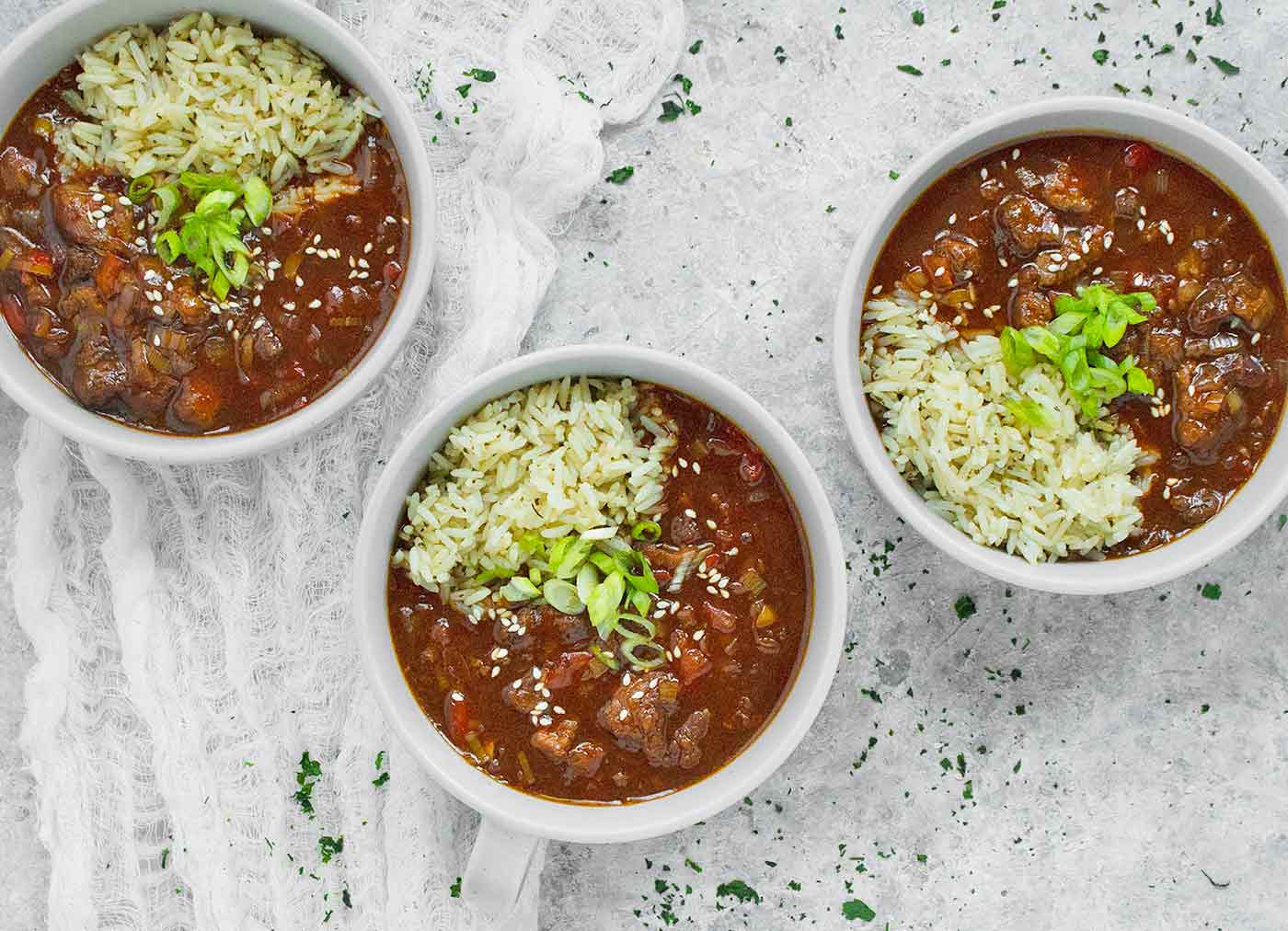 Three bowls of Mongolian Beef Soup, ready to serve