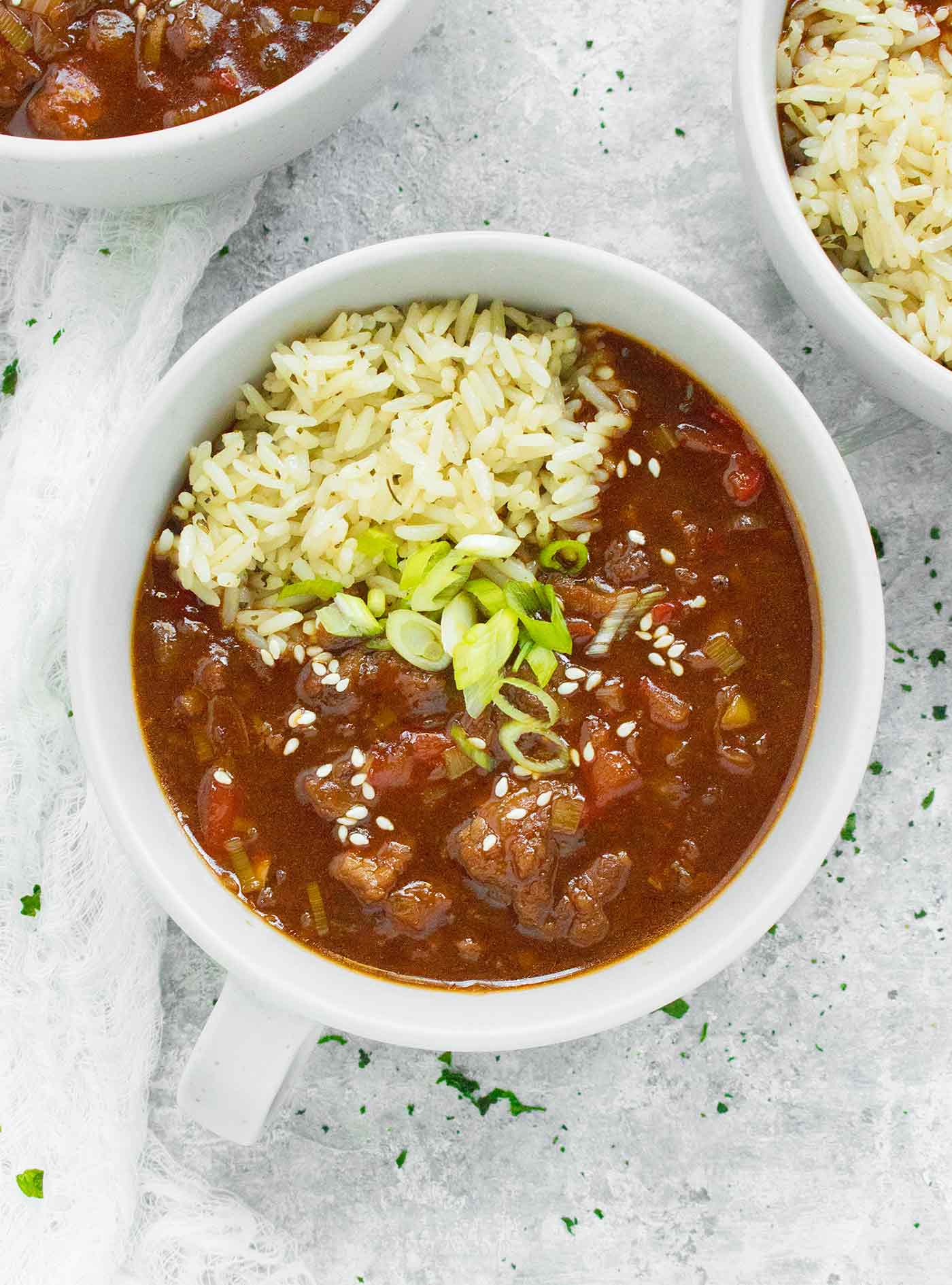 Close-up of a bowl of Mongolian Beef Soup, served with rice