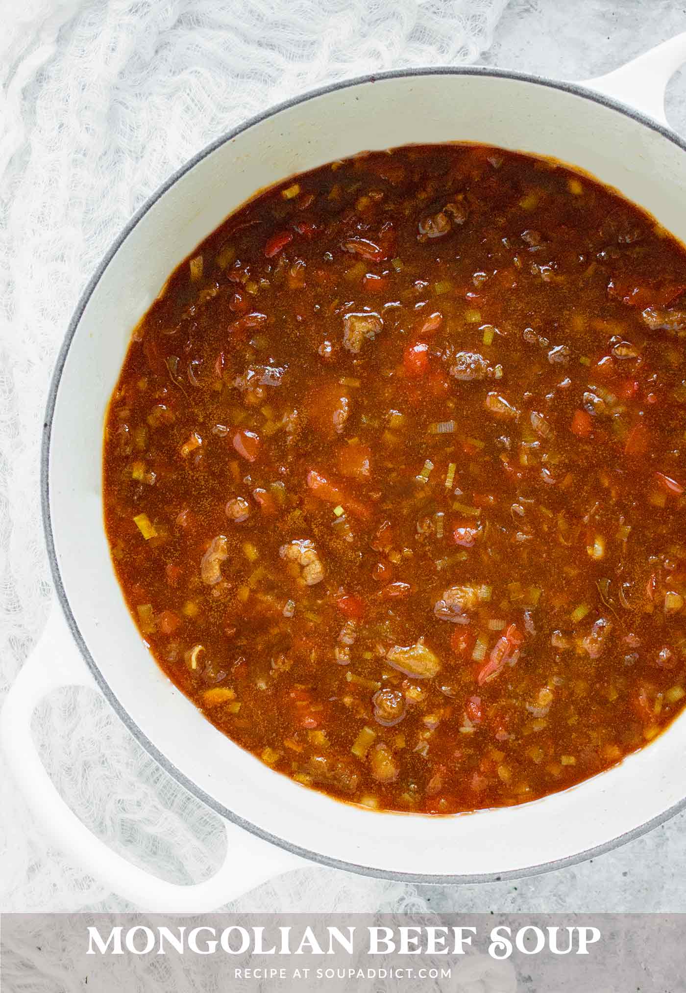Mongolian Beef Soup in a large white Dutch oven